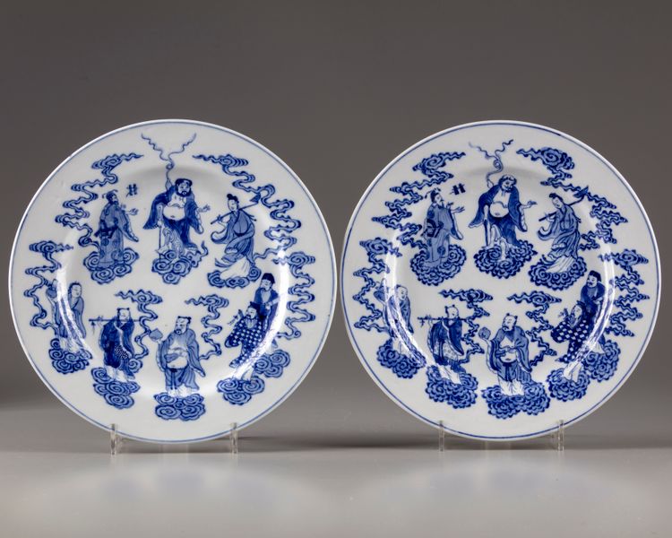 A pair of Chinese blue and white 'Eight Immortals' dishes