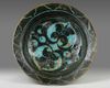 A KASHAN TURQUOISE HIGH PLATE BLACK FLOWER DECORATION, PERSIA, 13TH CENTURY