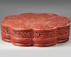 A LARGE CHINESE CINNABAR LACQUER FLORIFORM BOX AND COVER, QING DYNASTY (1644-1911)