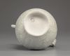 A Chinese celadon-glazed carved ewer and cover