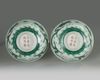 A pair of Chinese green glazed 'dragon' bowls