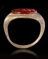 A ROMAN BRONZE RING WITH CARNELIAN INTAGLIO, CIRCA 2ND-3RD CENTURY A.D.