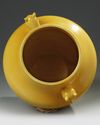 A CHINESE MUSTARD YELLOW GLAZED VASE WITH DEAR HANDLES