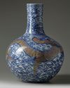 A LARGE CHINESE UNDERGLAZE COPPER RED AND BLUE AND WHITE 'DRAGON' VASE, QING DYNASTY (1644-1911)
