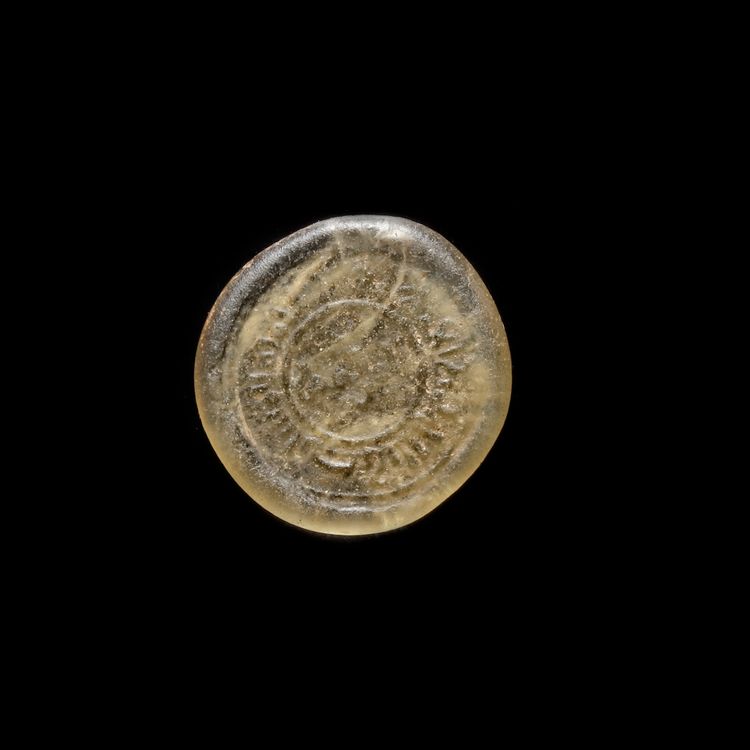 A FATIMID GLASS WEIGHT OF DIRHAM, AL-MUSTANSIR BI-ALLAH (AH 427-487 / 1036-1094 AD)