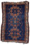 AN ANTIQUE CAUCASIAN SHIRVAN RUG WITH THREE STAR MEDALLIONS