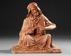 A TERRACOTTA SCULPTURE DEPICTING AN ARAB MAN