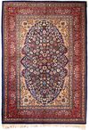 A HEREKE WOOL RUG, CA. 1950-1960