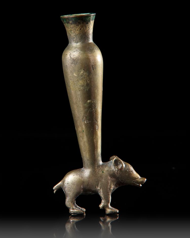 AN PERSIAN TINNED BRONZE KOHL VESSEL IN THE FORM OF A BOAR, CIRCA 1ST CENTURY B.C.