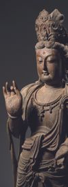 A CHINESE STANDING POLYCHROME WOOD FIGURE OF GUANYIN, LATE MING DYNASTY