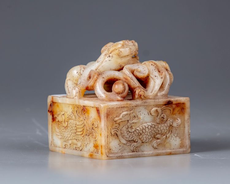 A large pale and russet jade 'chilong' seal