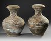 A PAIR OF PAINTED TERRACOTTA HU VASES WITH COVERS, CHINA, HAN DYNASTY (206 BC-220 AD)