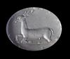 AN AGATE SCARABOID EAST GREEK WITH A STAG, CIRCA 500 BC