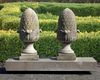 A PAIR OF CARVED LIMESTONE PIER FINIALS, 20TH CENTURY