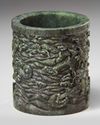 A carved spinach green jade brush pot