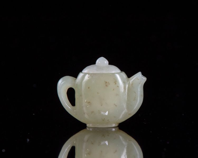 A Chinese jade miniature teapot. and cover