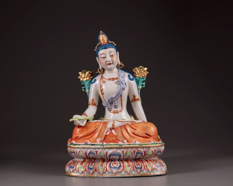 A Chinese famille rose figure of Avalokitesvara on a double lotus base