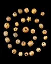 A FATIMID COLLECTION OF ORNATE GOLD BEADS, 11TH-13TH CENTURY