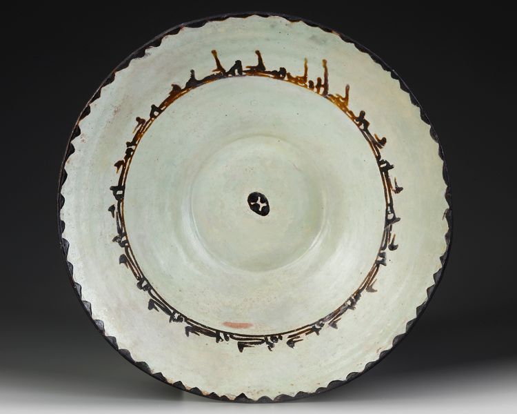 A SAMANID SLIP-PAINTED POTTERY BOWL, PERSIA, 10TH CENTURY