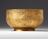 A PERSIAN GILT COPPER BOWL
