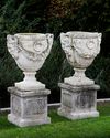 A PAIR OF COMPOSTION STONE GARDEN URNS, LATE 20TH CENTURY