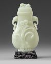 A Chinese pale celadon jade vase and cover