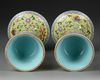 A PAIR OF CHINESE YELLOW-GROUND FAMILLE ROSE GU VASES, QING DYNASTY (1644-1911)