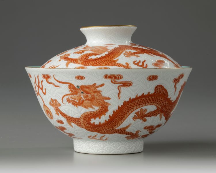 A Chinese white-ground sgraffiato iron-red-decorated 'dragon' bowl and cover