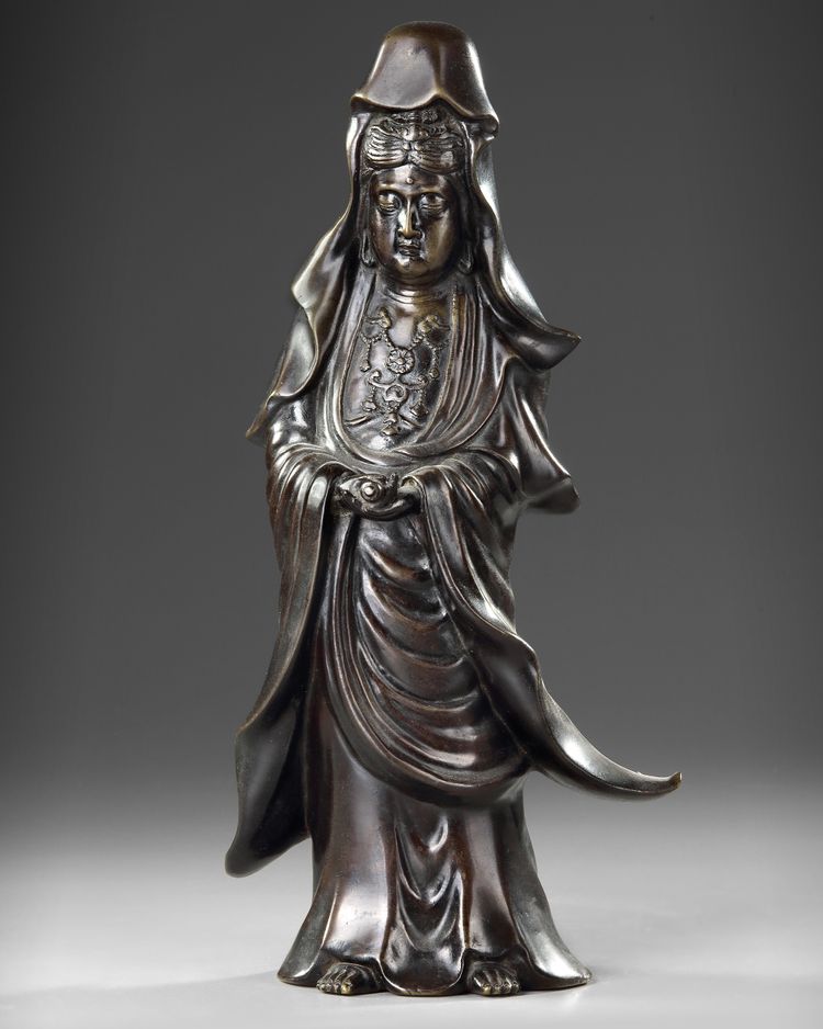 A CHINESE BRONZE FIGURE OF GUANYIN, 20TH CENTURY