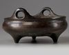 A Chinese bronze tripod censer