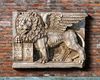 A SCULPTED MARBLE PLAQUE WITH THE VENETIAN LION OF SAINT MARK, LATE 20TH CENTURY, AFTER THE ANTIQUE