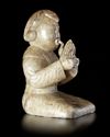 A CREAMY WHITE JADE OF A SHENG-PLAYING MUSICIAN, CHINA, HAN DYNASTY (206 BC-220 AD)