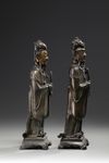 A pair of Chinese parcel gilt bronze standing scholars