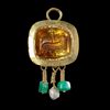 A BYZANTINE GOLD PENDANT WITH A TOPAZ INTAGLIO OF THE LAMB OF GOD, 5TH/6TH CENTURY AD