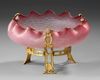 A FRENCH ART NOUVEAU CRANBERRY MAT GLASS BOWL ON A GOLD PLATED BRONZE FOOT, CIRCA 1880-1890