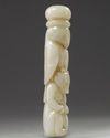 A Chinese pale celadon jade ying xiong knife hilt