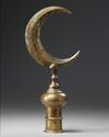 An Ottoman gilt-bronze tombak finial
