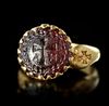 A BYZANTINE GOLD RING SET WITH A GARNET INTAGLIO, 6TH CENTURY AD OR LATER