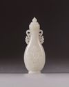 A small Chinese white jade flattened baluster vase and cover