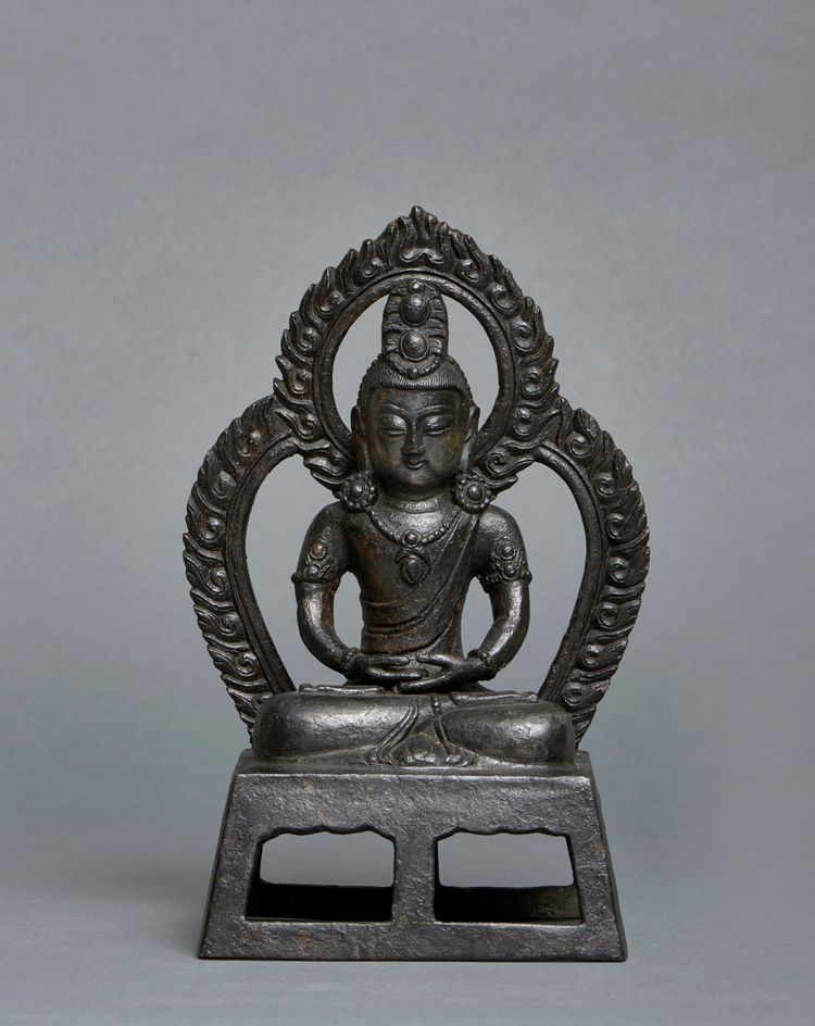 A Chinese dark bronze figure of Amitayus
