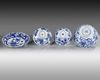 Three Chinese blue and white bowls and a dish