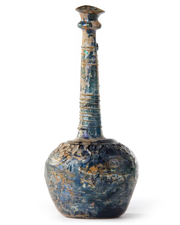 A TALL-NECKED BLUE GLASS BOTTLE, PERSIA OR SYRIA, 11TH-12TH CENTURY