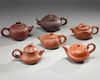 A group of six Chinese medium-sized yixing teapots