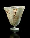 AN ISLAMIC LUSTRE-DECORATED GLASS CUP, SYRIA, 9TH-11TH CENTURY