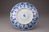A blue and white porcelain plate with floral decorations