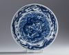 A large Chinese Ming-style blue and white 'dragon' charger