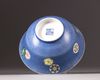 A Chinese blue-ground sgraffiato famille rose 'roundels' bowl