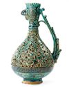 A RARE FRITWARE OPENWORK DECORATED RETICULATED EWER WITH ROOSTER HEAD, PERSIA, 13TH CENTURY