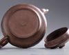 A Chinese Yixing 'landscape' teapot and cover