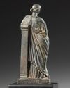 A ROMAN BRONZE STATUETTE OF APHRODITE / VENUS LEANING ON A PILLAR, CIRCA 1ST CENTURY B.C - A.D.